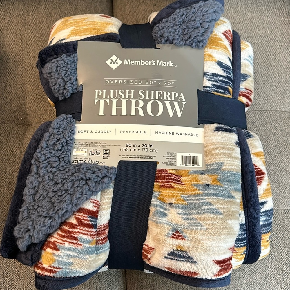 60x70 inch plush throw-cream SW pattern, on one side with blue Sherpa other side